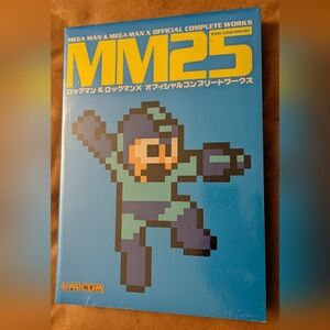 25th Anniversary Book - Blue Paperback- Mega Man Official Complete Works